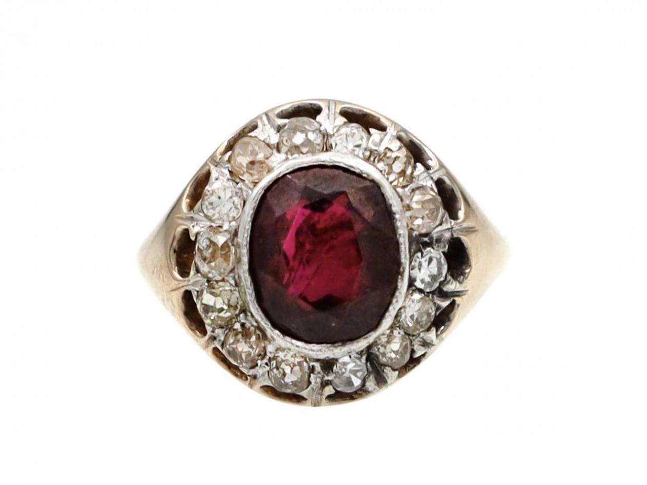 Antique garnet and diamond oval cluster ring in 18kt yellow gold