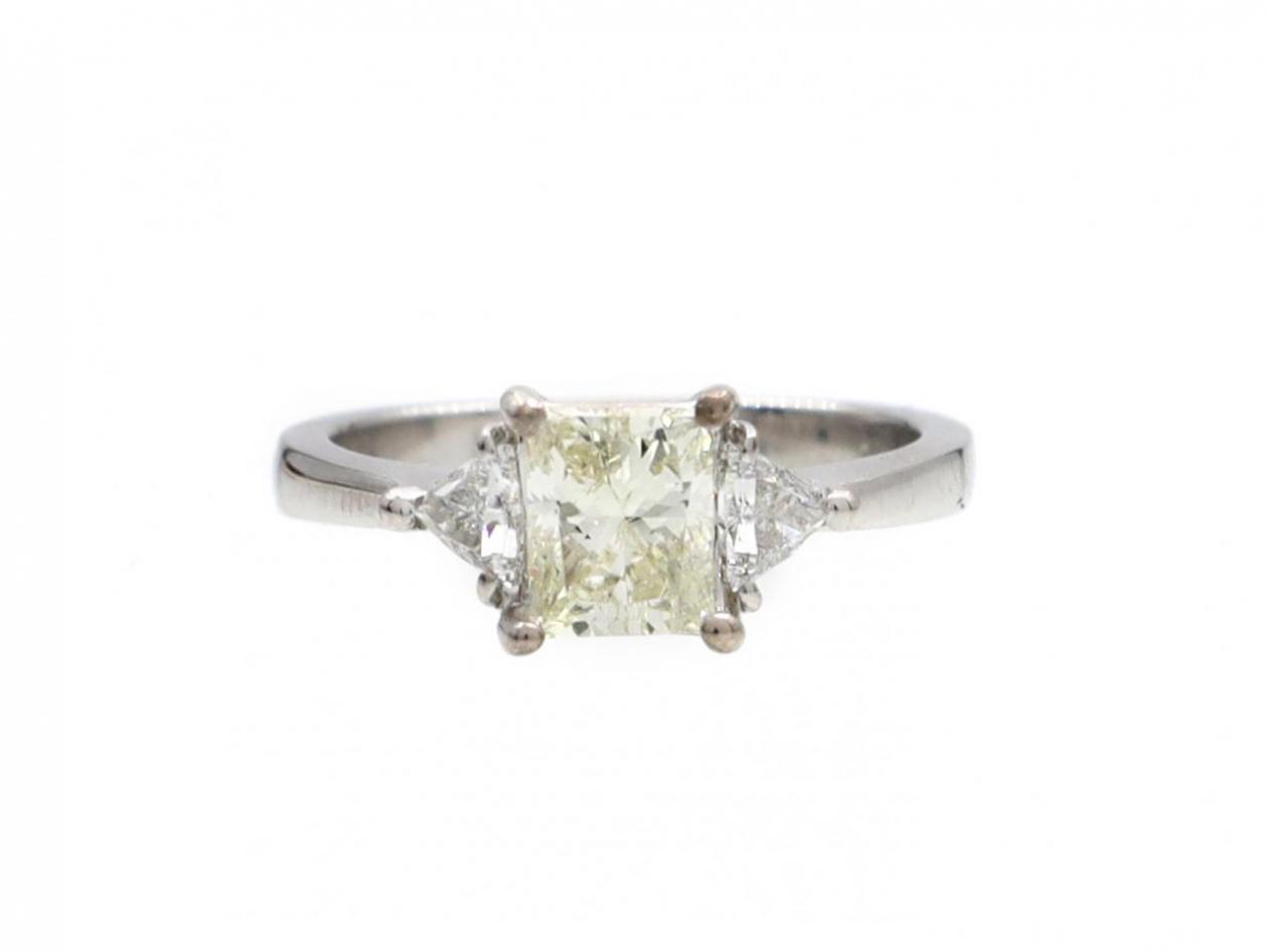 Light yellow diamond and diamond three stone engagement ring