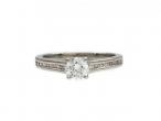 0.41ct round brilliant cut diamond flanked solitaire ring