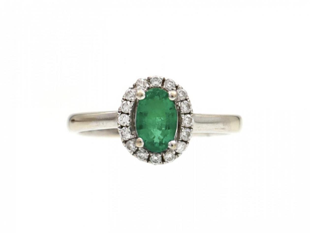 Vintage emerald and diamond oval cluster ring in 14kt white gold