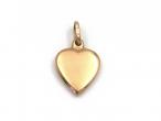 Antique 9kt rose gold heart pendant set with a garnet