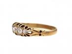 Antique graduating five stone diamond ring in yellow gold