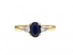 Contemporary sapphire and diamond three stone ring in gold