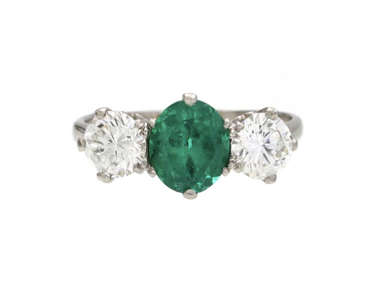Vintage emerald and diamond three stone ring in platinum