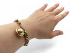 Antique fancy link bracelet with globular serpent locket closure in gold