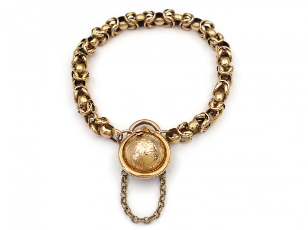 Antique fancy link bracelet with globular serpent locket closure in gold