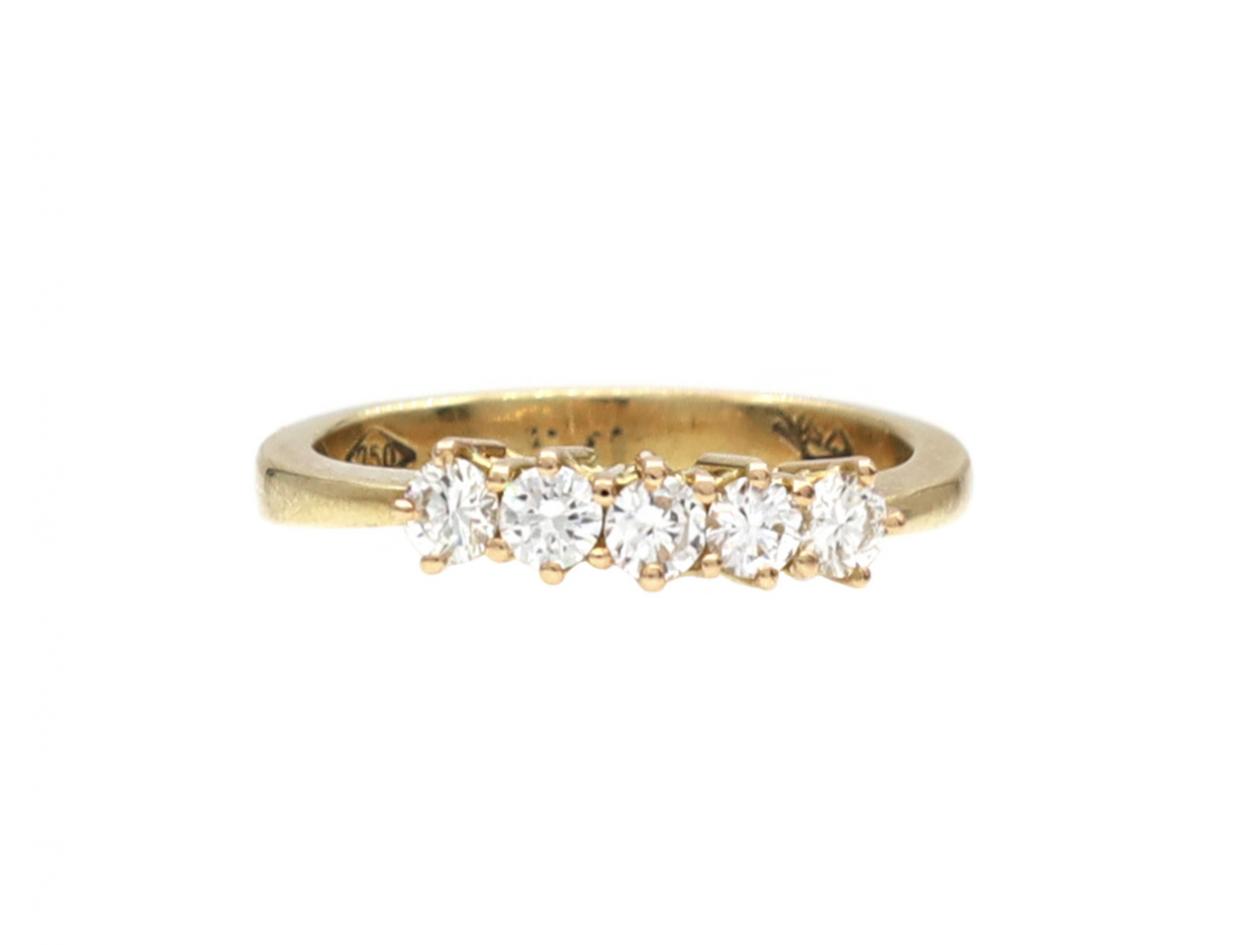 Modern five stone diamond ring in 18kt yellow gold