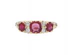 1902 ruby and diamond three stone carved ring in 18kt yellow gold