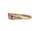 1902 ruby and diamond three stone carved ring in 18kt yellow gold