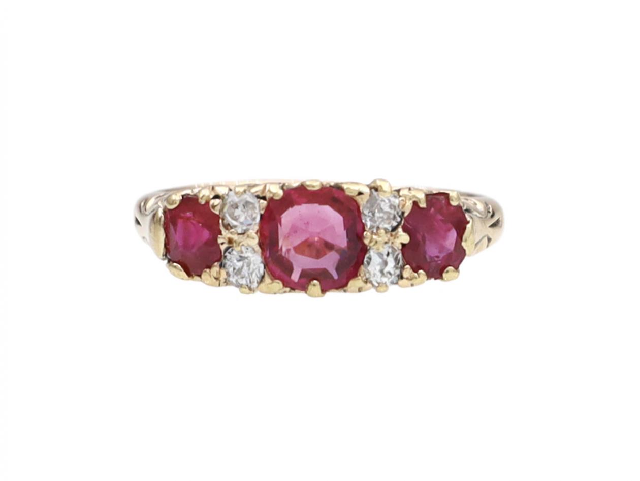1902 ruby and diamond three stone carved ring in 18kt yellow gold