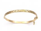 1980s engraved solid hinged bangle in 9kt yellow gold