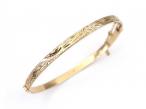 1980s engraved solid hinged bangle in 9kt yellow gold