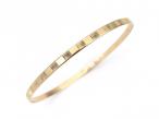 1980s flat 9kt yellow gold bangle with linear patterns