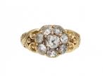 Antique diamond coronet cluster ring with carved shoulders