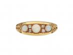 Edwardian three stone opal and diamond ring in 18kt yellow gold