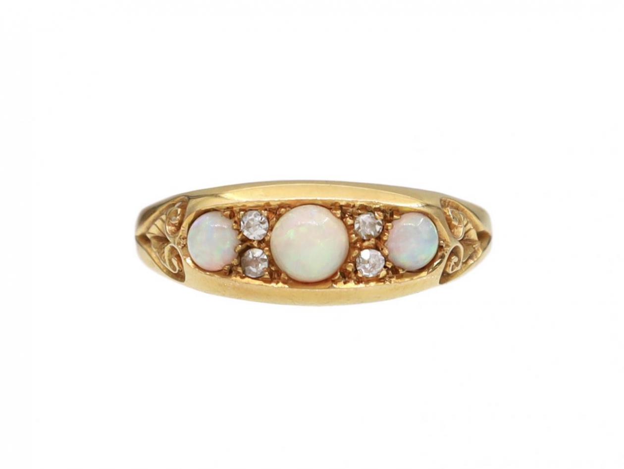 Edwardian three stone opal and diamond ring in 18kt yellow gold