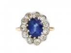 Antique oval sapphire and diamond flower cluster ring in gold