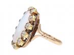 Antique oval opal and diamond cluster ring in yellow gold
