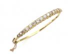 Vintage diamond set carved hinged bangle in 18kt yellow gold