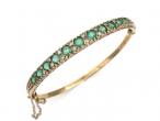 Vintage emerald and diamond hinged bangle in 9kt yellow gold