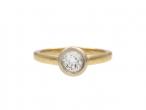 Bezel set diamond solitaire engagement ring in yellow gold