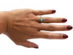 Art Deco style diamond and emerald target ring in platinum