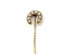 Antique natural pearl horseshoe stickpin in yellow gold