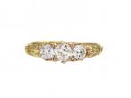Antique carved faces diamond three stone ring in 18kt yellow gold