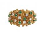 Modernist emerald and diamond textured ring in yellow gold