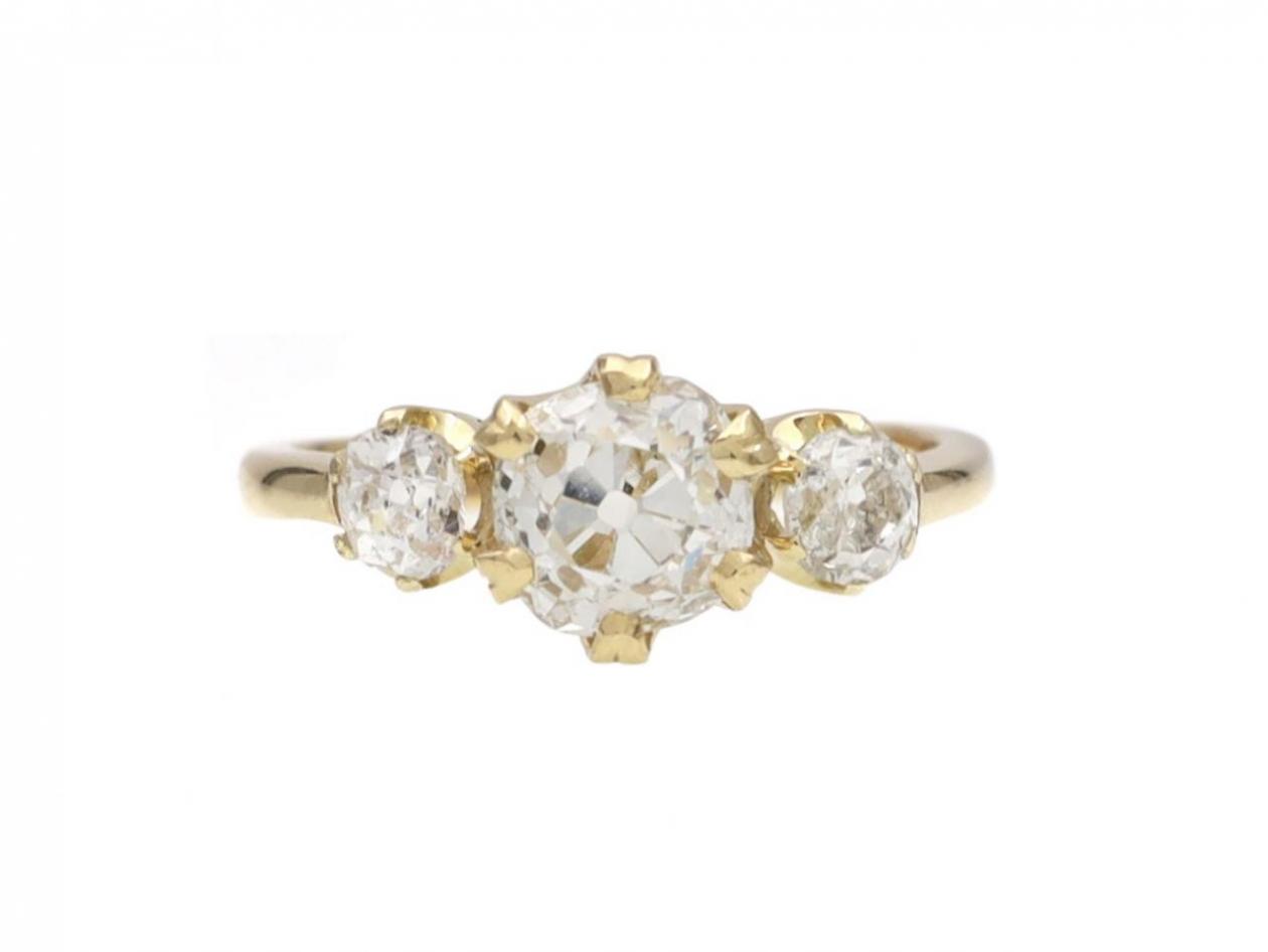 Vintage cushion shape diamond three stone engagement ring