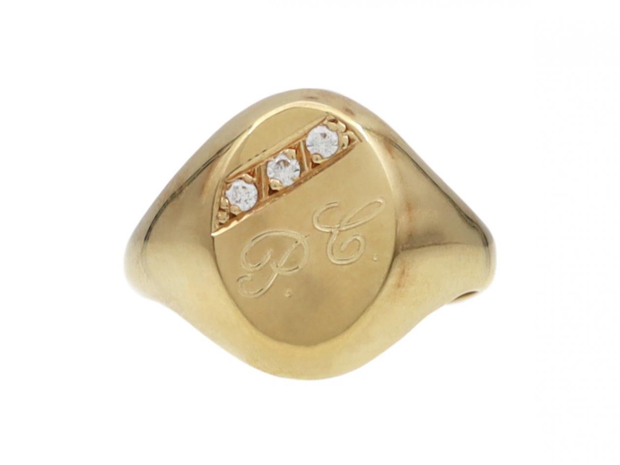 Vintage 18kt yellow gold and diamond oval signet ring