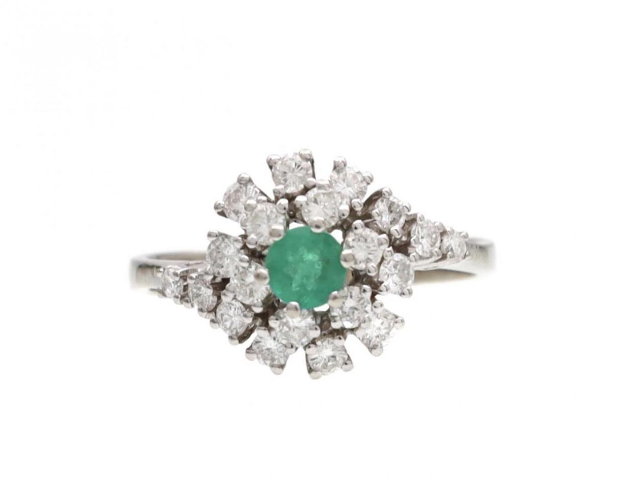 Contemporary emerald and diamond twisting cluster ring