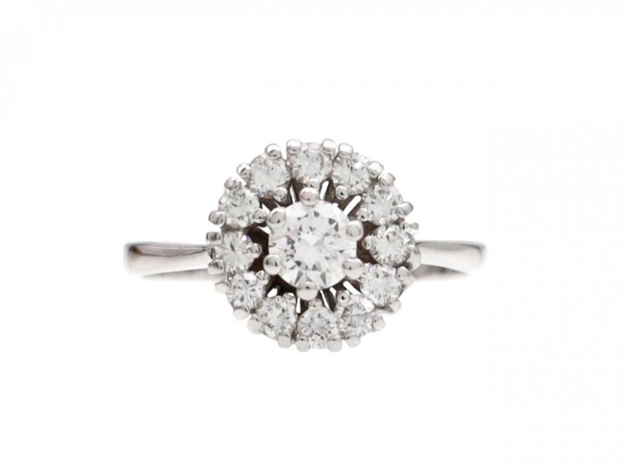 Contemporary diamond circular cluster engagement ring