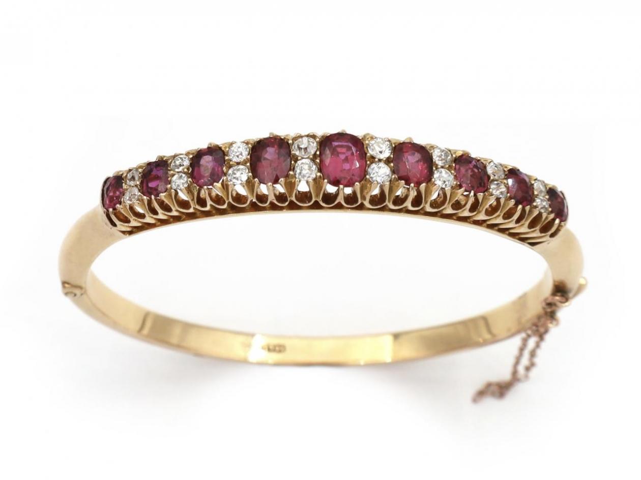 Antique ruby and diamond hinged bangle in yellow gold