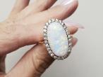 Edwardian oval opal and diamond cluster ring in 18kt yellow gold