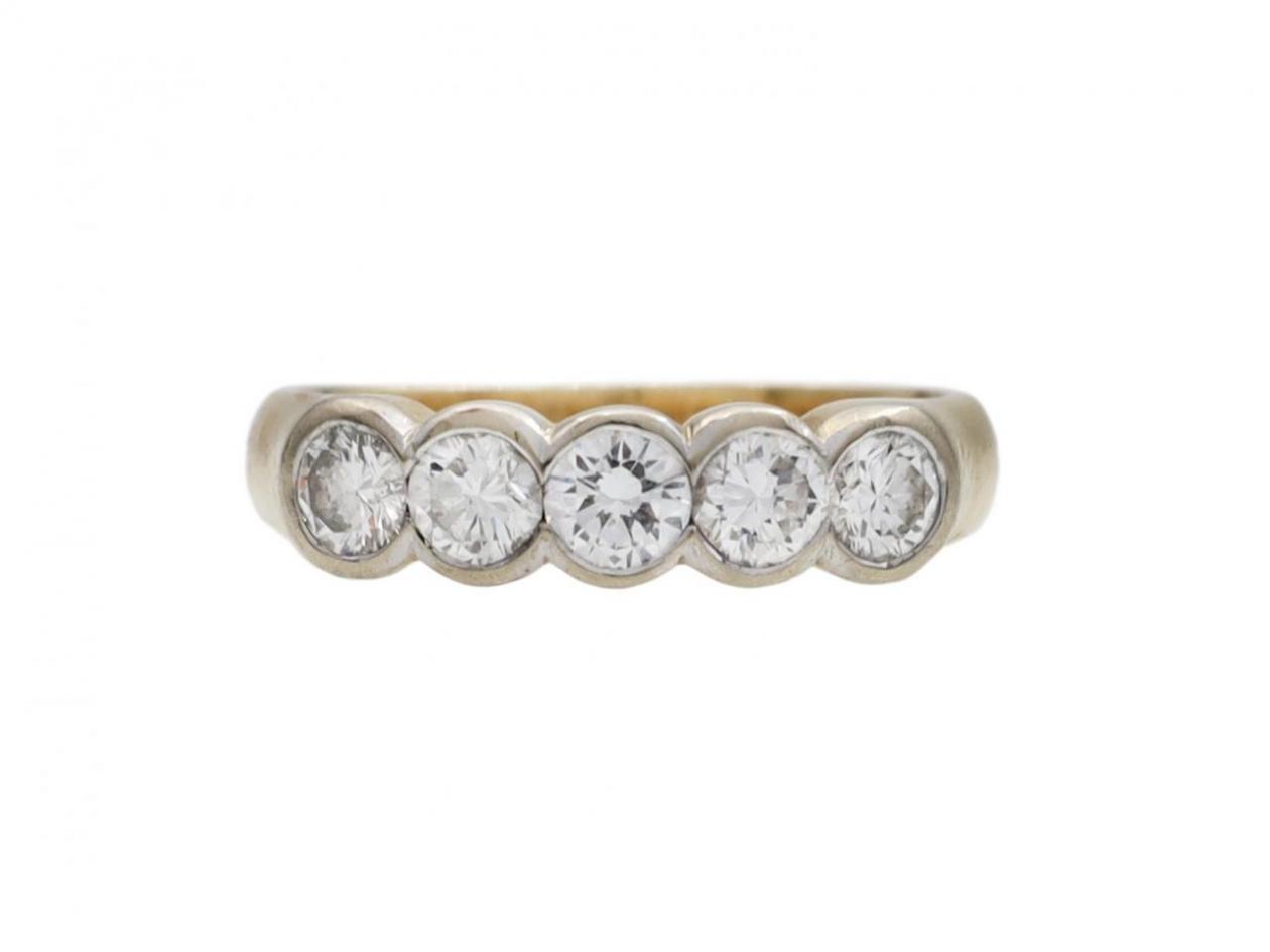 Five stone diamond ring in rubover settings