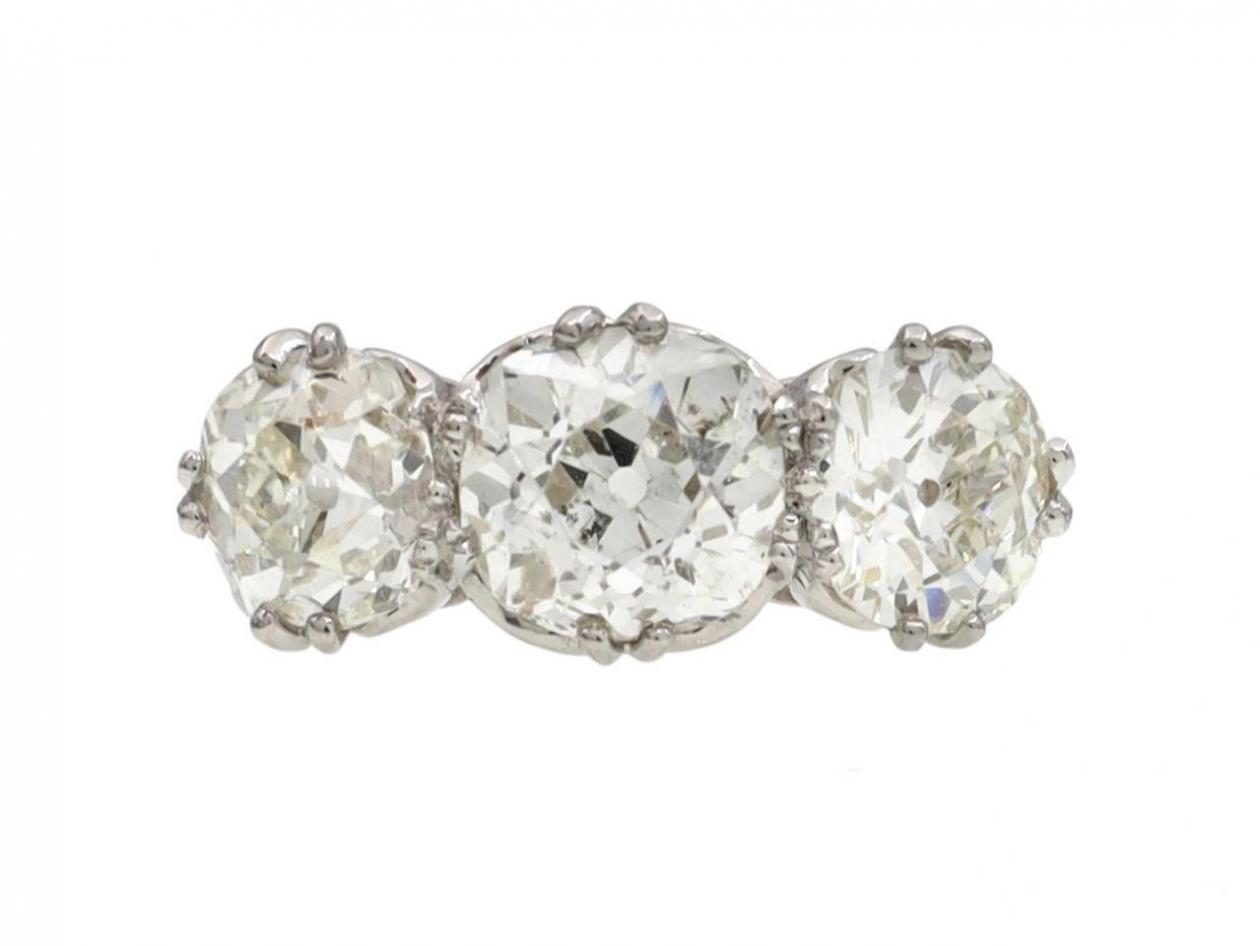 vintage cushion shape three stone diamond engagement ring in platinum