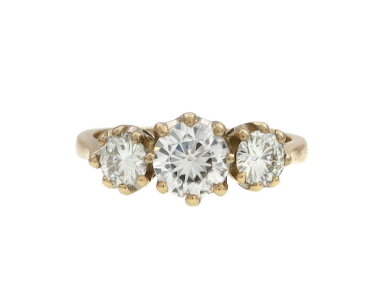 Vintage graduating three stone diamond engagement ring in gold