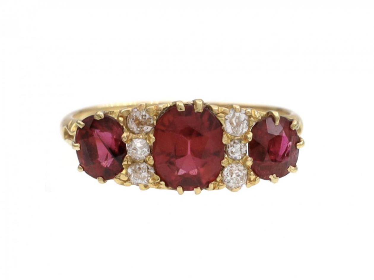 Victorian ruby and diamond three stone carved ring in 18kt yellow gold