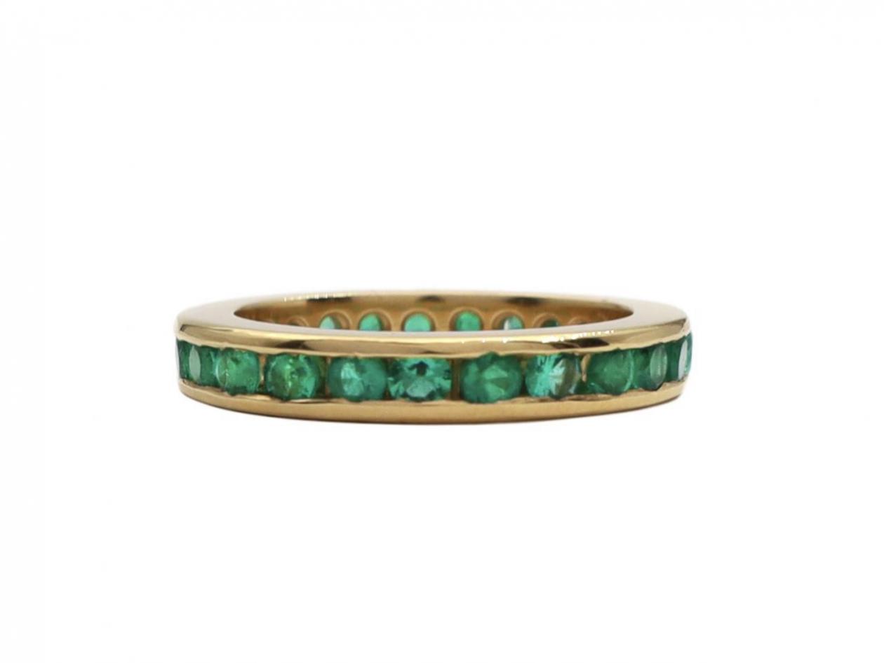 round cut emerald channel set full eternity ring 18kt yellow gold