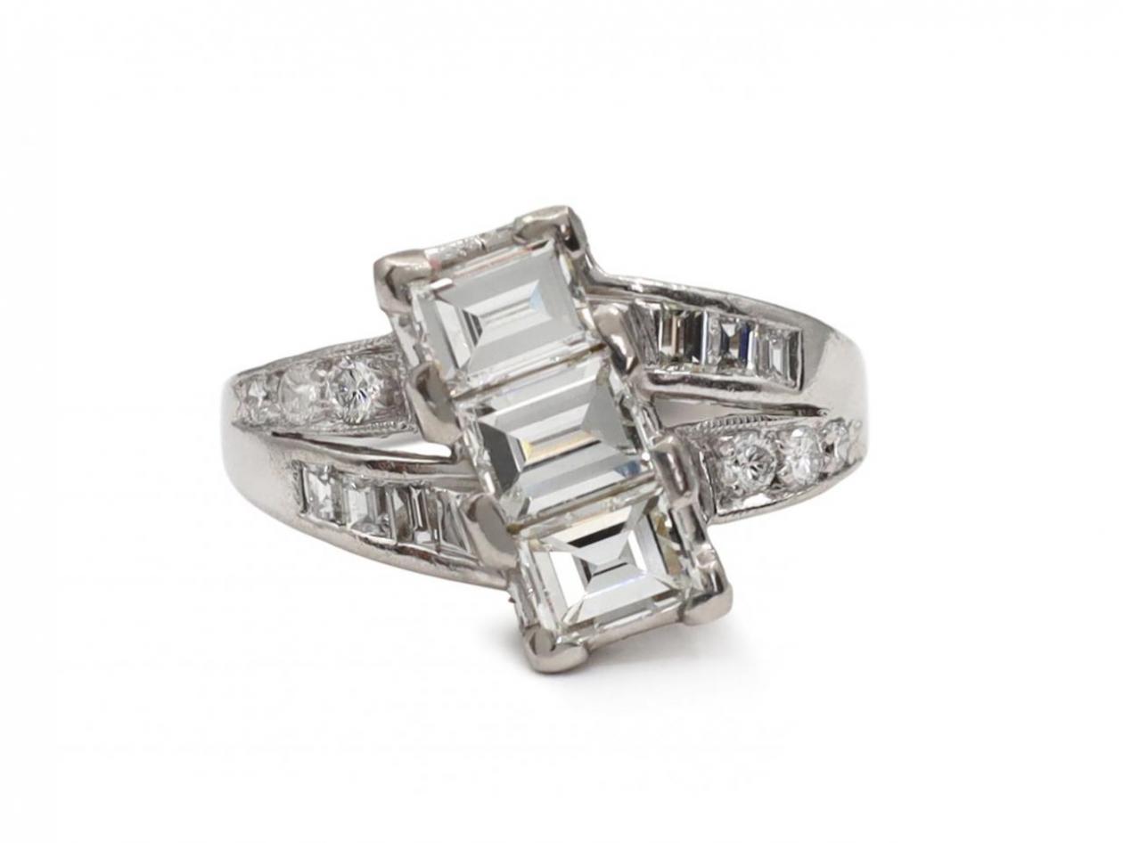 art deco diamond three stone twist ring in platinum