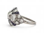 Art Deco diamond and calibre sapphire bombe cluster ring in platinum