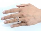 diamond solitaire ring on finger