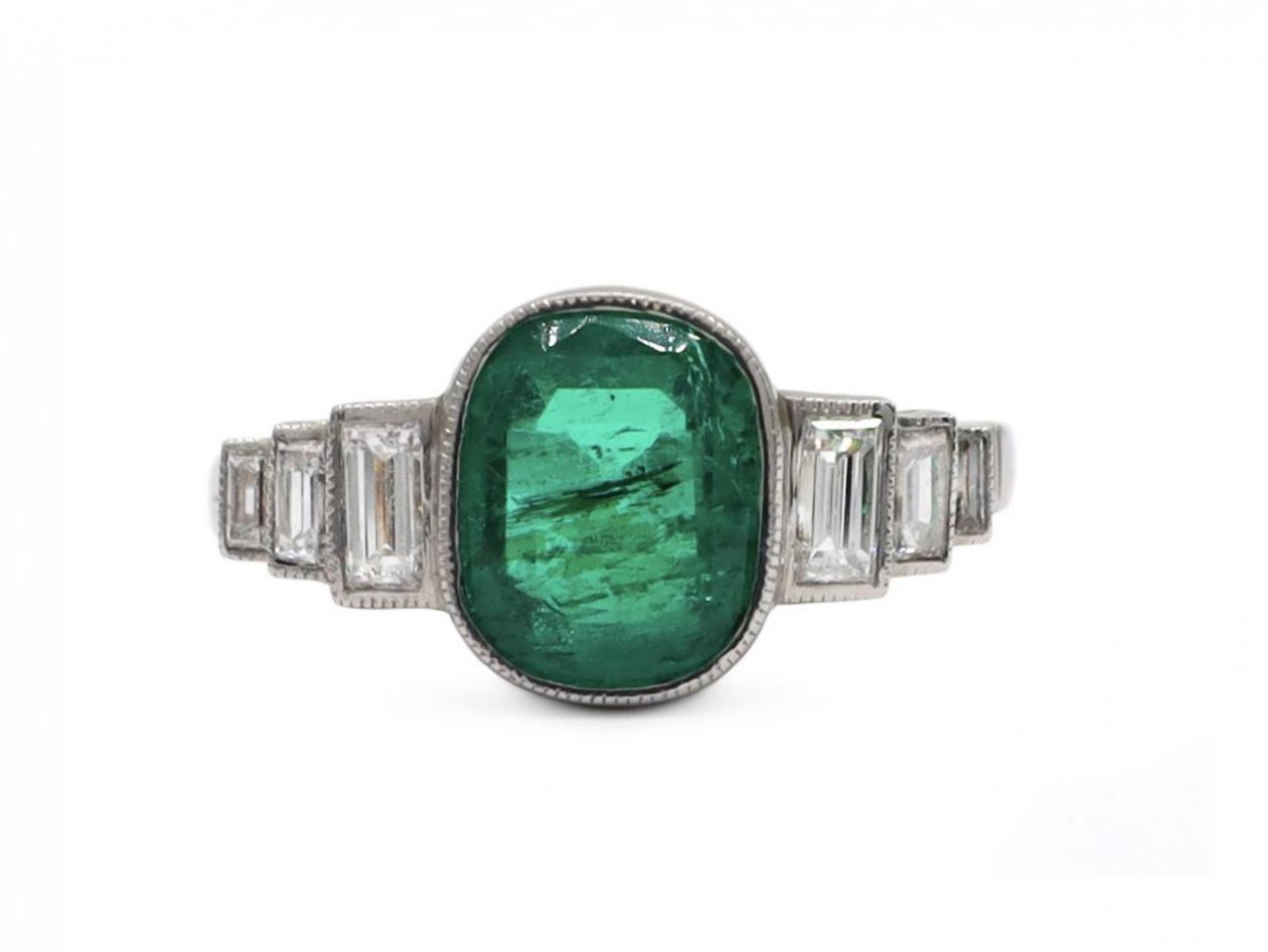 Art Deco style emerald and diamond step solitaire ring