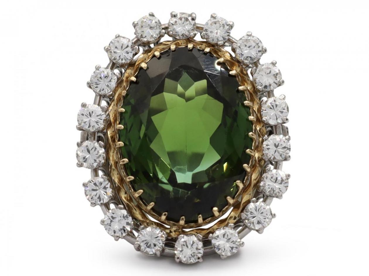 Retro green tourmaline and diamond oval cluster ring in gold and platinum