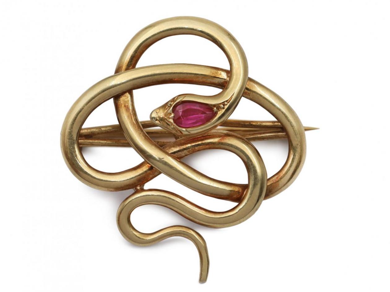 Vintage serpent brooch set with a synthetic ruby in 14kt gold