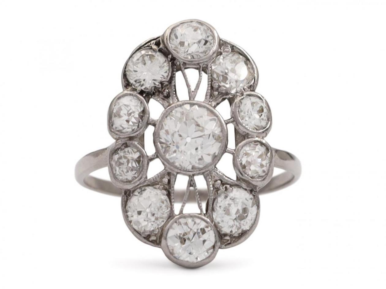 Antique diamond and platinum lace work oval cluster ring