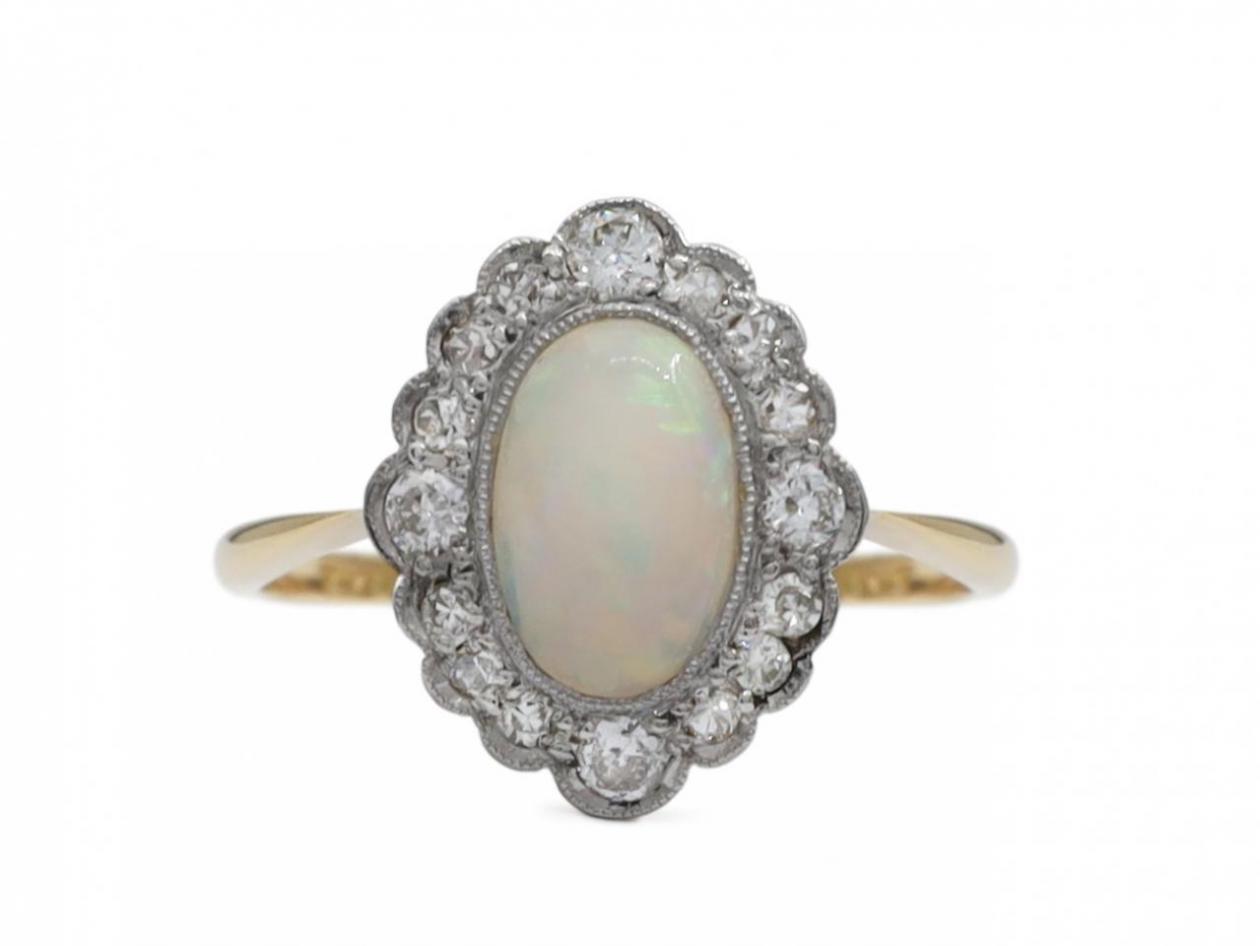Edwardian opal and diamond oval cluster ring in platinum on gold
