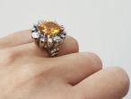Modern 6.52ct fancy yellowish orange sapphire and old cut diamond cluster ring
