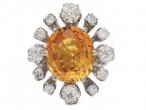 Modern 6.52ct fancy yellowish orange sapphire and old cut diamond cluster ring